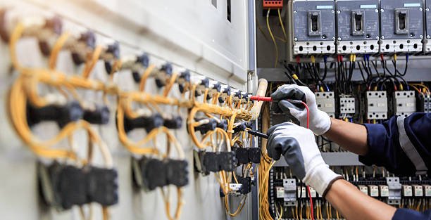 Professional Electrician technician working in Hales Corners, WI